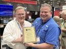 ARRL CEO David Minster, NA2AA (left), presented recognition awards to Icom America Inc. and Senior Sales Manager Ray Novak, N9JA, for their generous support of ARRL, including the 2025 ARRL Membership Drive. The presentation was made at the 2025 Huntsville Hamfest in August.